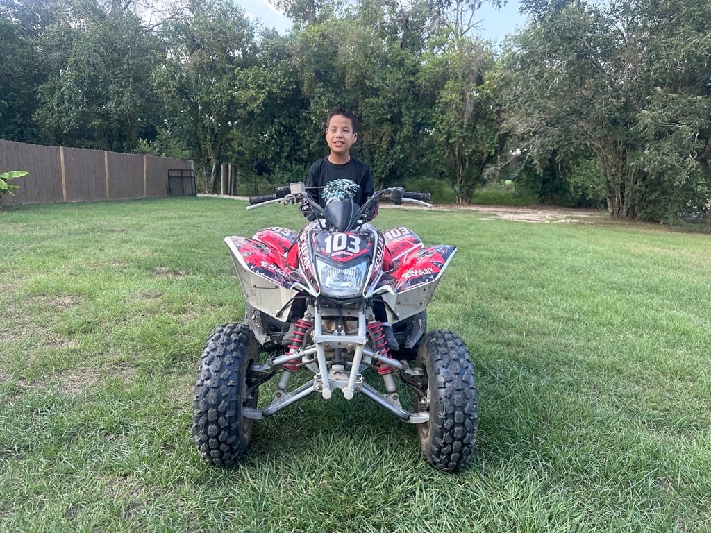 Louisiana Boy With Rare FoxP1 Syndrome Races ATVs, Inspires Gene Therapy Awareness