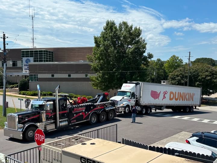 Dunkin’ Delivery Truck Breakdown Near Police Station Sparks Social Media Humor