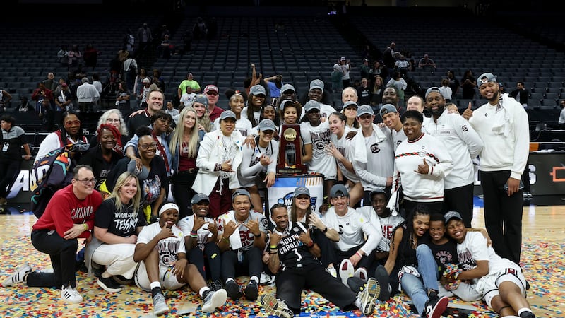 South Carolina poses for a photo with the trophy during post game celebrations after winning...