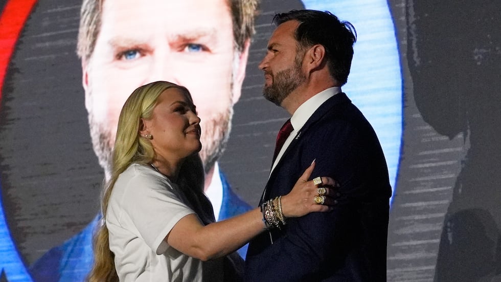 Erika Kirk, left, hugs Vice President JD Vance speaks during a "This Is the Turning Point"...