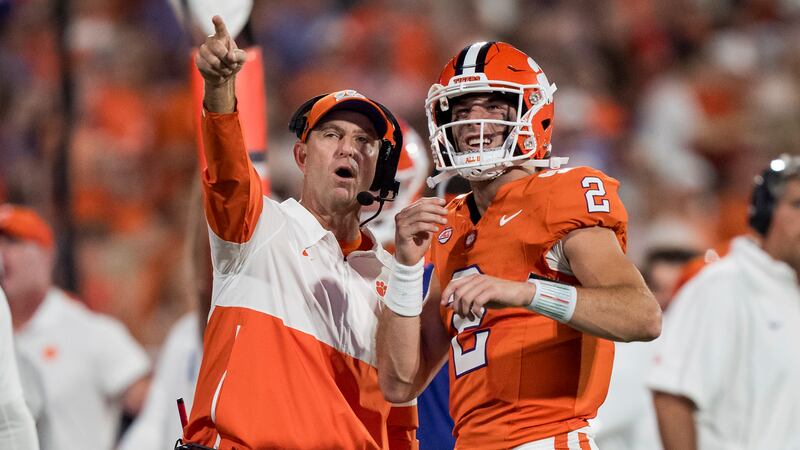 Clemson head coach Dabo Swinney looks on with quarterback Cade Klubnik (2) in the first half...