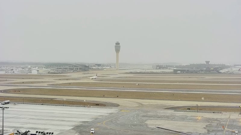 FILE -- Snow flurries shown at Hartsfield-Jackson Atlanta International Airport.