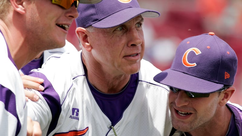 FILE - In this May 31, 2013, file photo, Clemson's coach Jack Leggett huddles witgh his...