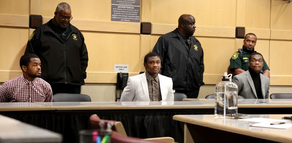 CORRECTS THE POSITIONS OF WILLIAMS AND NEWSOME - Dedrick Williams, left, Trayvon Newsome,...